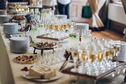 Celebration party with guests raising glasses